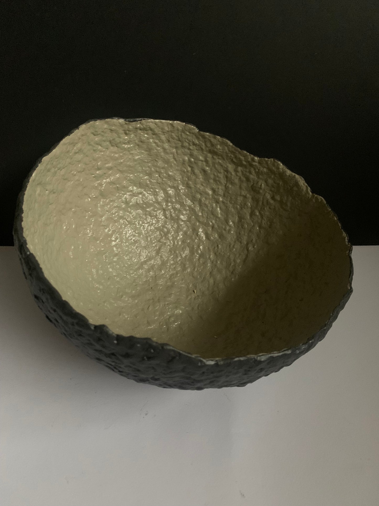 Tilted black bowl