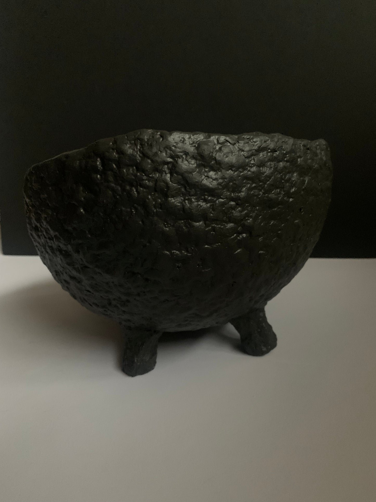 Tilted black bowl