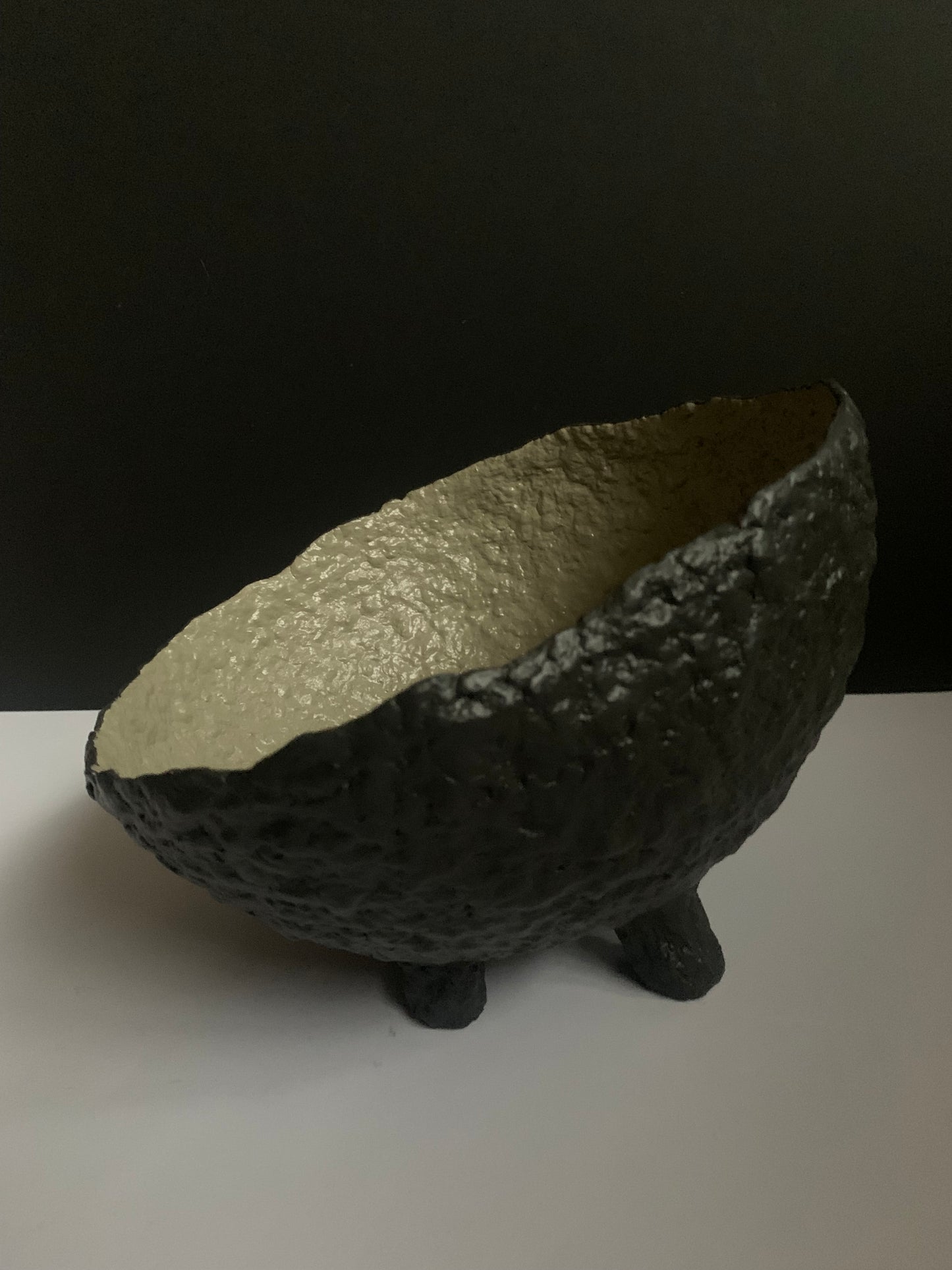 Tilted black bowl