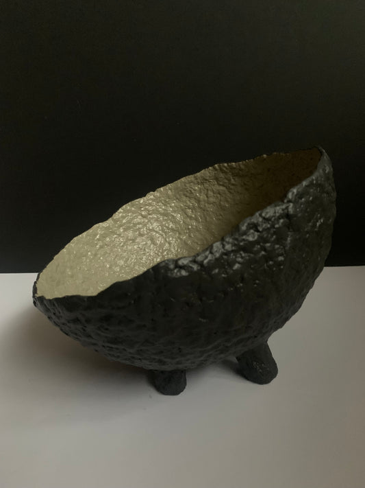 Tilted black bowl