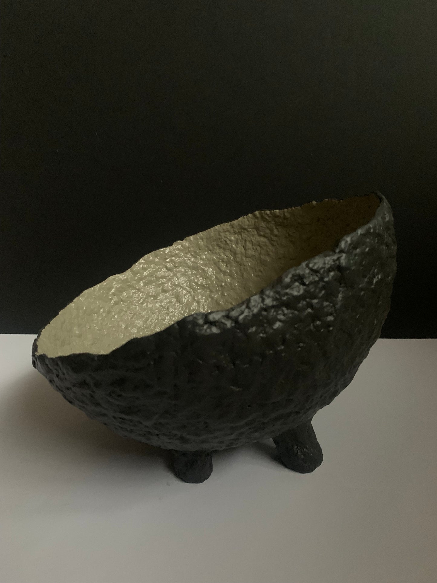 Tilted black bowl