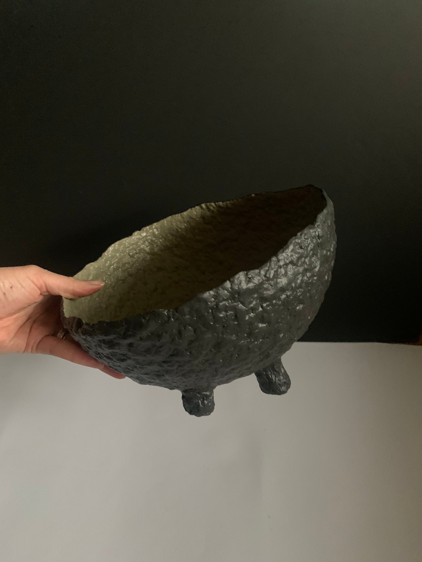 Tilted black bowl