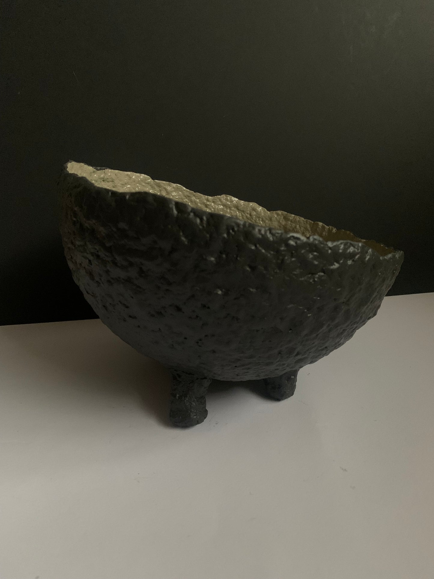 Tilted black bowl