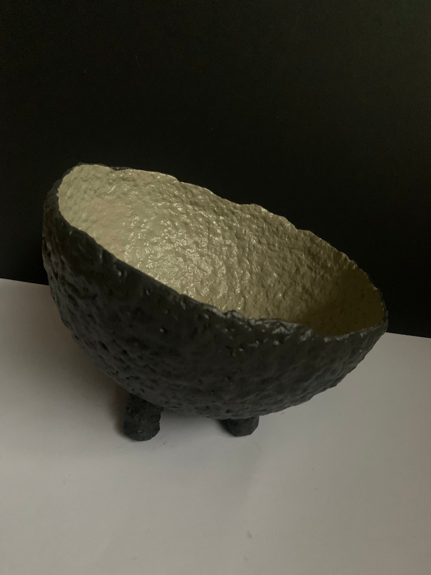 Tilted black bowl